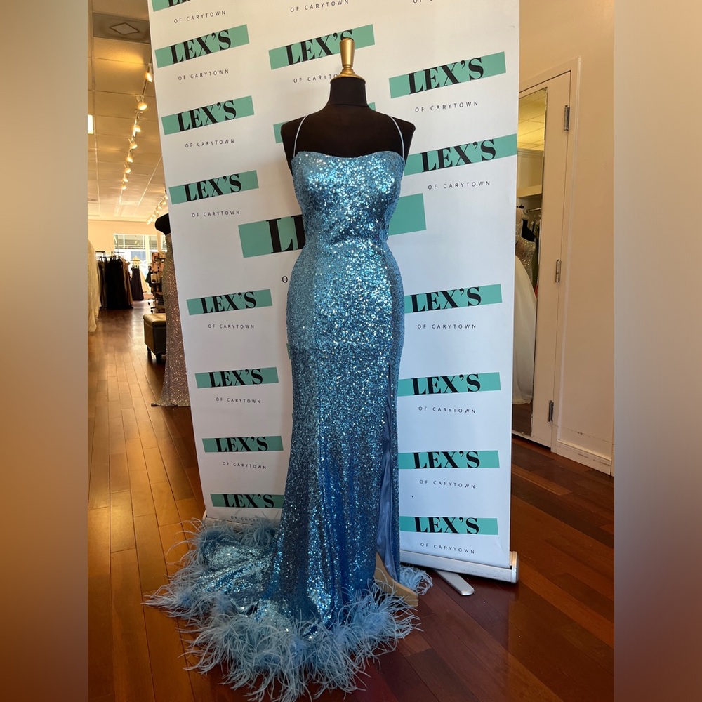 Sherri Hill fitted sequin gown with lace up, slit, and ostrich feathered hem